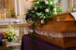 Flowers on coffin in church